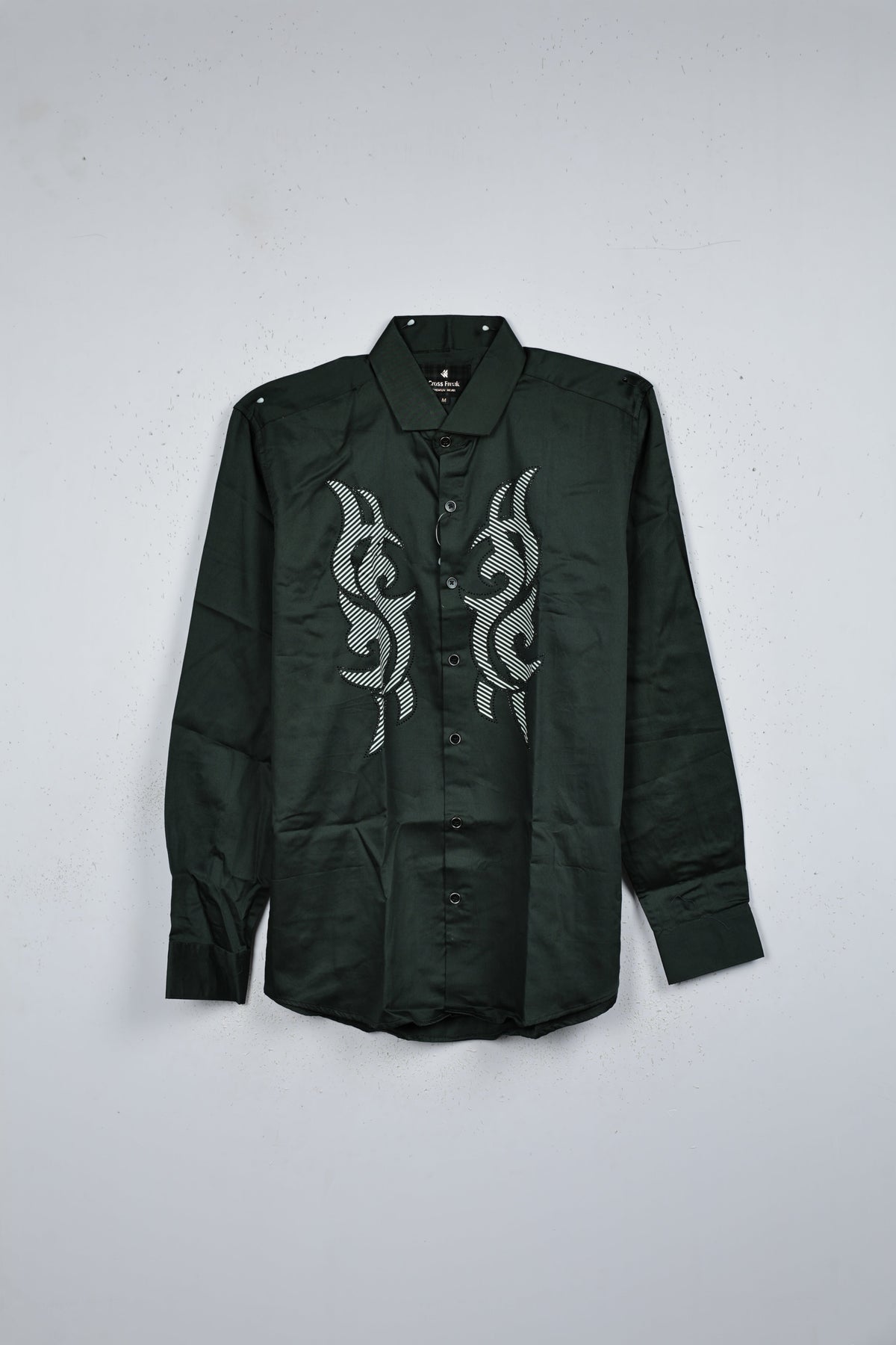 Green colour shirt designed with white print and black stone on body, adored with half sleeve.