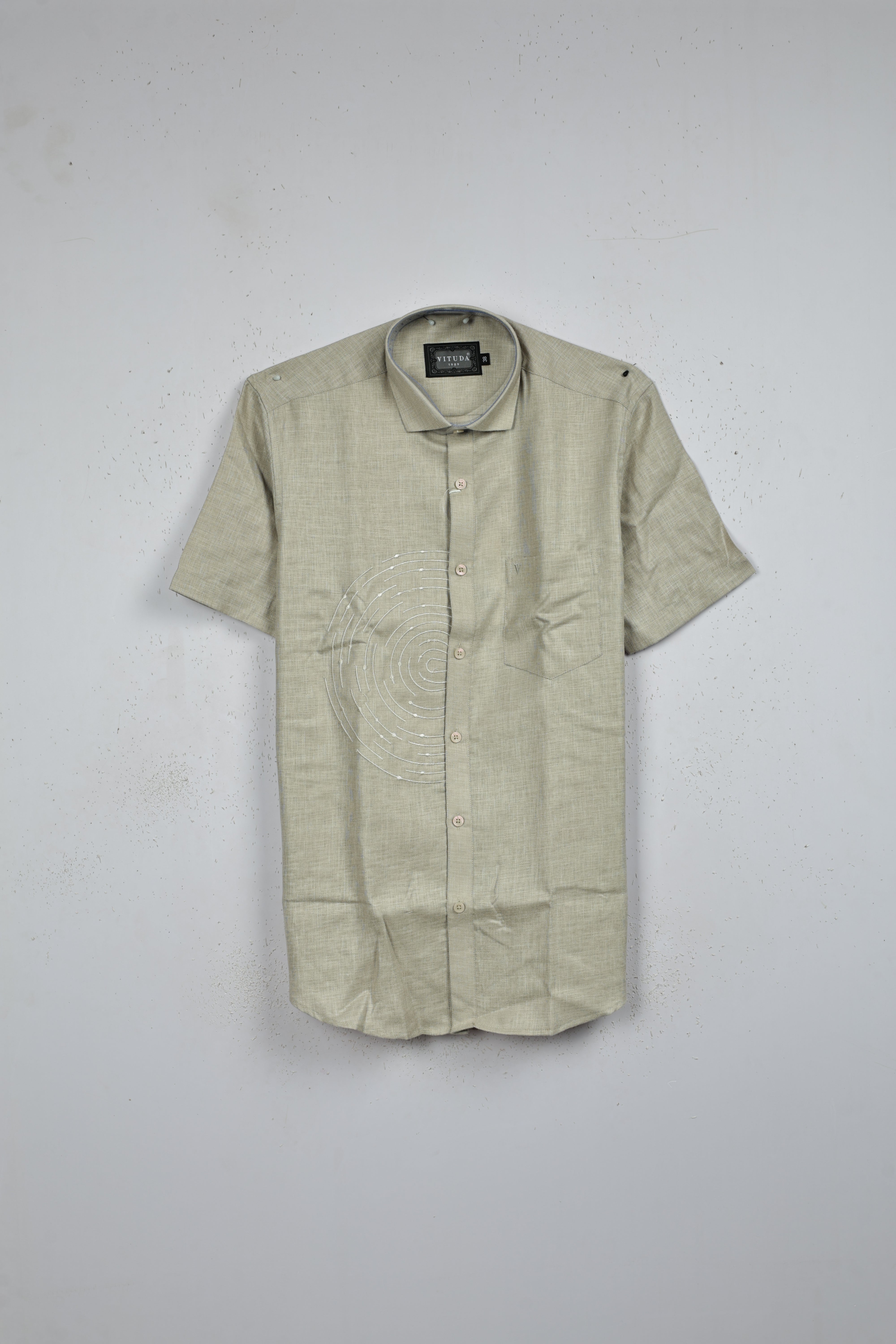 Grey colour shirt designed with thread pattern on body, adored with half sleeve.
