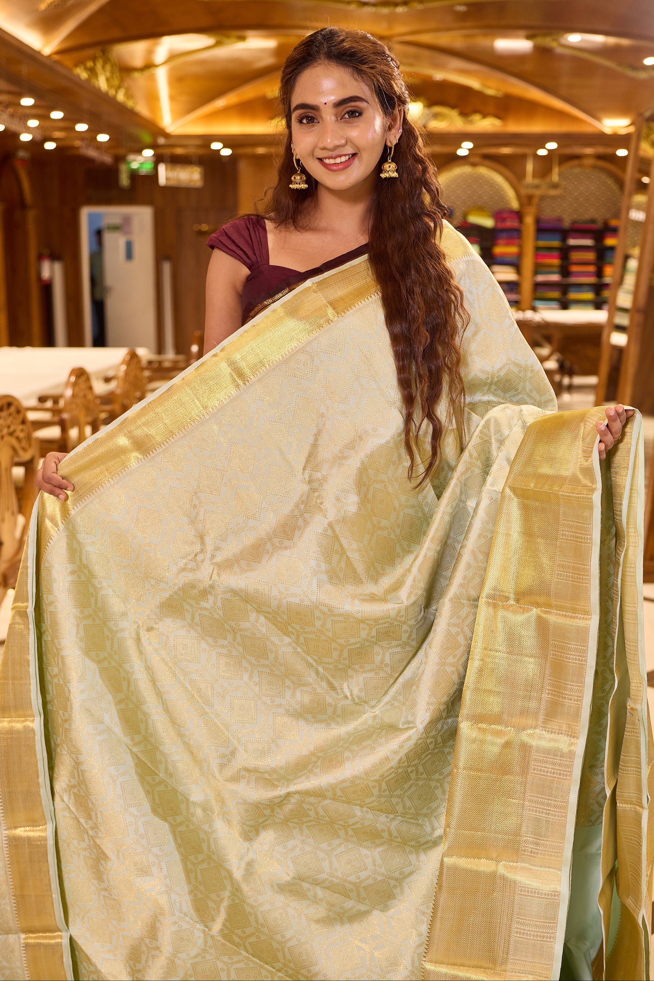 Powder Blue Kanchipuram Samudrika Silk Saree with traditional gold jari diamond and floral wedding brocade weaving, finished with a rich gold border and paired with a plain blouse featuring a traditional jari border