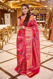 Red pink dual shade Rankat Kanchipuram Samudrika Silk Saree adorned with 5 colour silk thread and golden zari wave motifs, finished with a traditional arumbu malligai mayilkan border, rich arai madam lotus pallu, and a matching self plain blouse.
