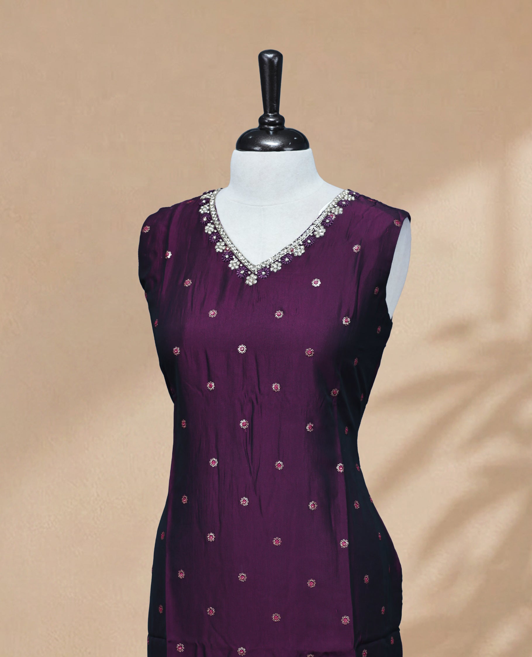Purple  Colour Kurti featuring  Sequin & Threadwork across the body, a V-shaped neckline adorned with bead and mirror work and a sleeveless design.