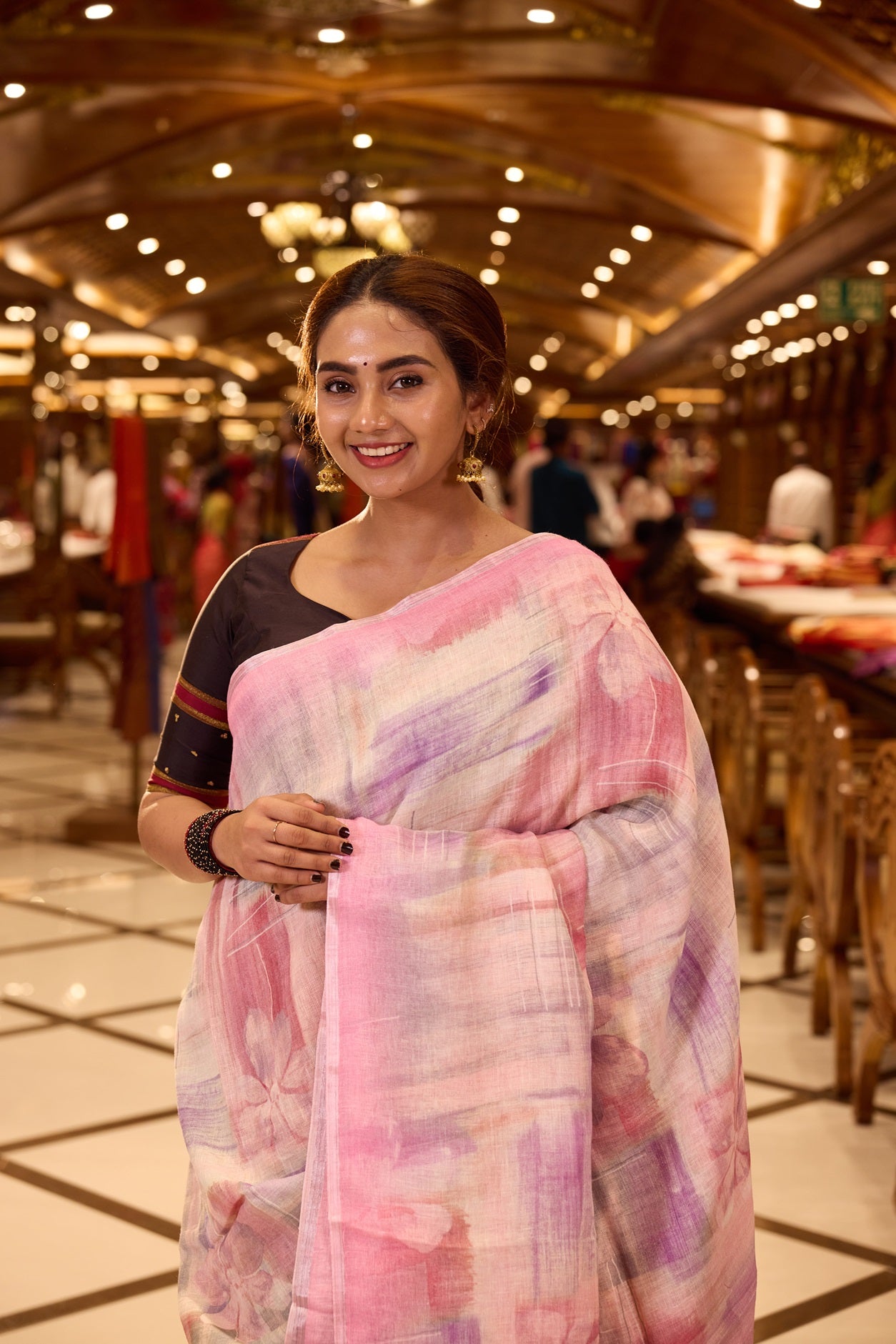 Pastel Pink Pure Linen Silk saree featuring a soft hand brushed body design in delicate hues, elegantly complemented by a shimmering silver zari border and pallu, and paired with a matching blouse piece.