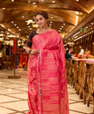 Plush Pink Kanchipuram Parampara Pattu saree featuring elegant diagonal geometric tissue zari line weaving with embossed silk patterns across the body, enhanced by a refined zari piping border and paired with a matching blouse piece.
