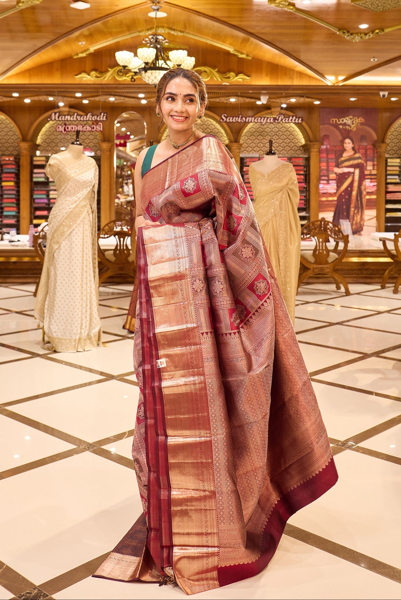 Wine Maroon Colour Kanchipuram Silk Saree with geometric box motif pattern, antique jari shimmer Meena Kari weaving, and traditional antique copper border. Paired with matching blouse piece.