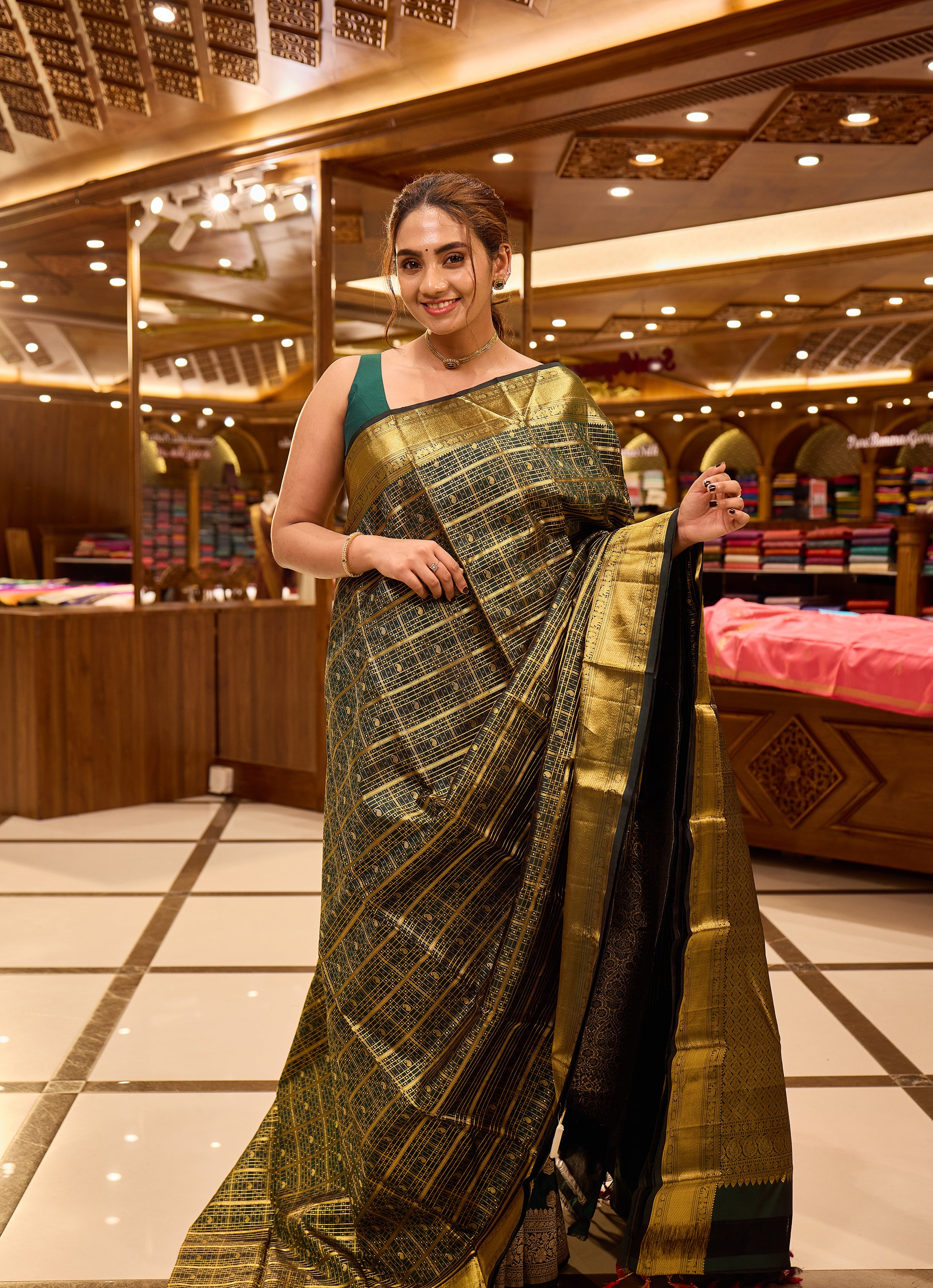 Bottle green colour pure Kancheepuram silk saree featuring gold zari checks all over the body with a gold zari border, complemented by a rich pallu and a matching silk blouse.
