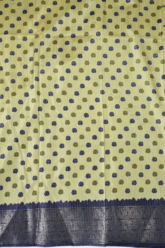 Olive green colour dolla silk saree adorned with beautiful kalamkari prints, complemented by a rich golden zari border & The pallu features intricate kalamkari detailing, paired with a matching blouse.