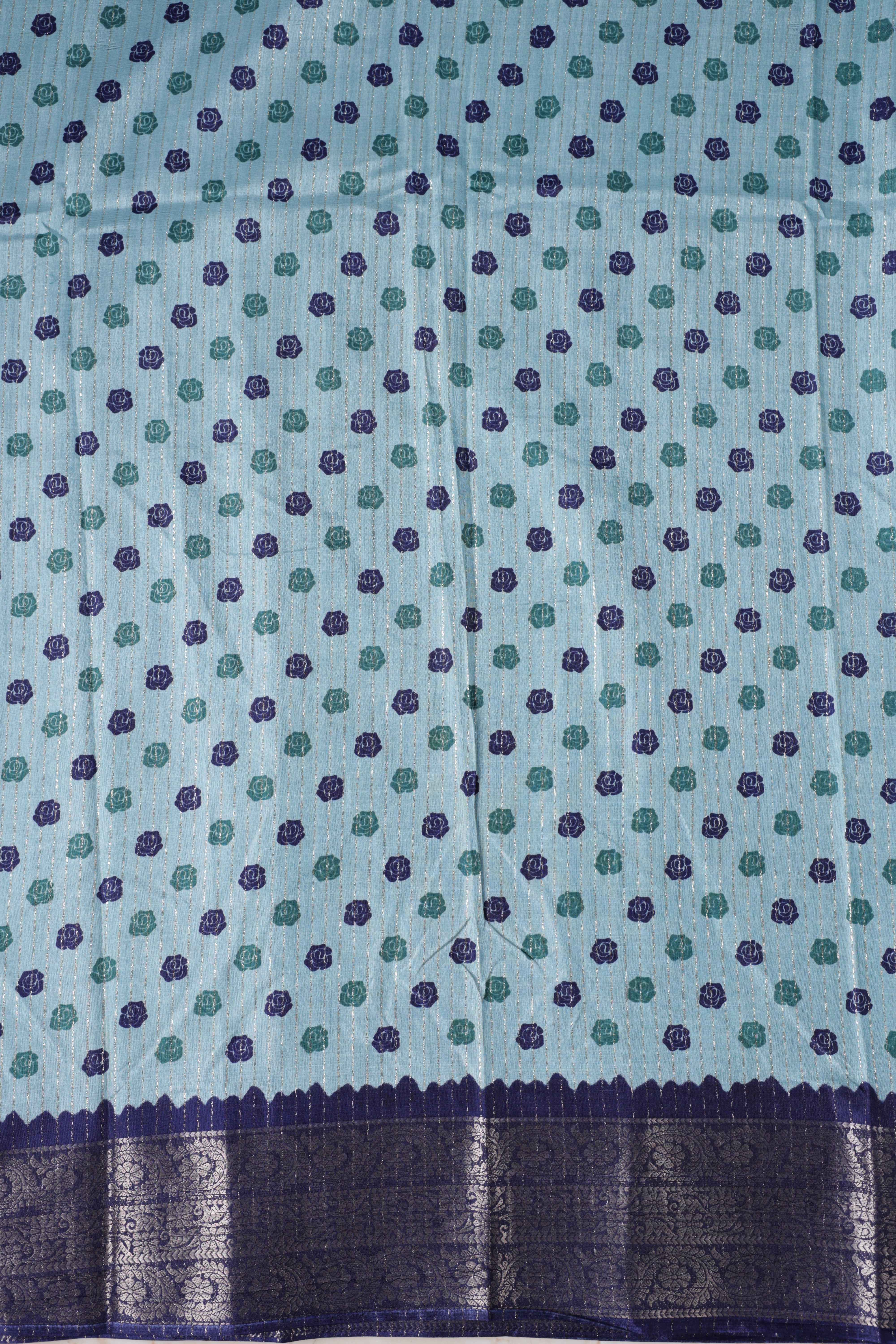 Blue colour dolla silk saree adorned with beautiful kalamkari prints, complemented by a rich golden zari border & The pallu features intricate kalamkari detailing, paired with a matching blouse.