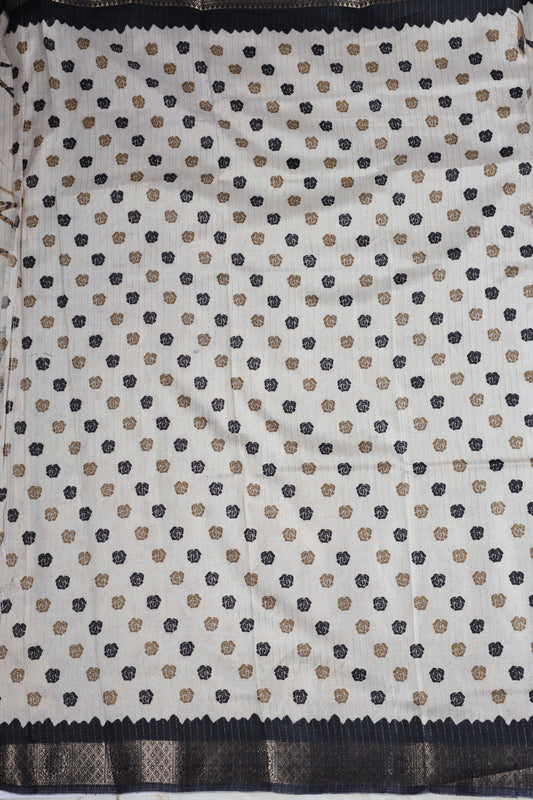 Beige colour dolla silk saree adorned with beautiful kalamkari prints, complemented by a rich golden zari border & The pallu features intricate kalamkari detailing, paired with a matching blouse.