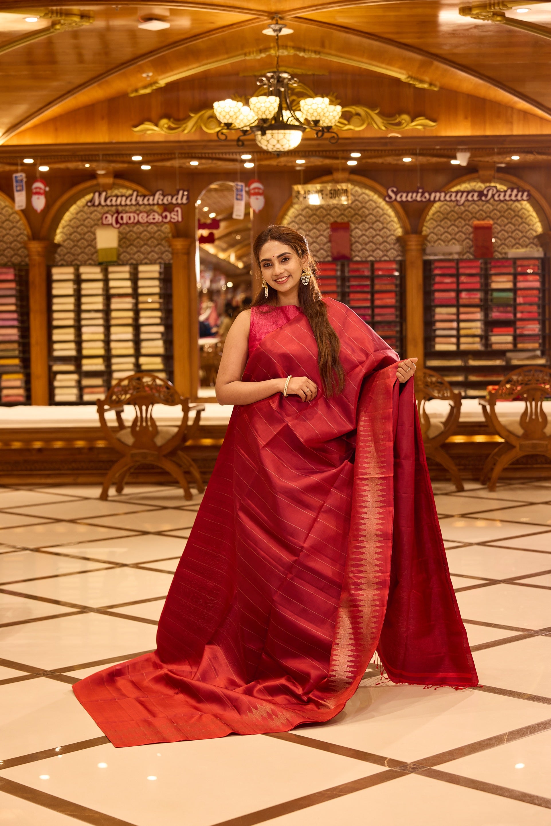 Brick red colour pure Mayuri Soft silk saree featuring a graceful striped body and a refined double temple border on one side, finished with a rich sheen and paired with a matching blouse