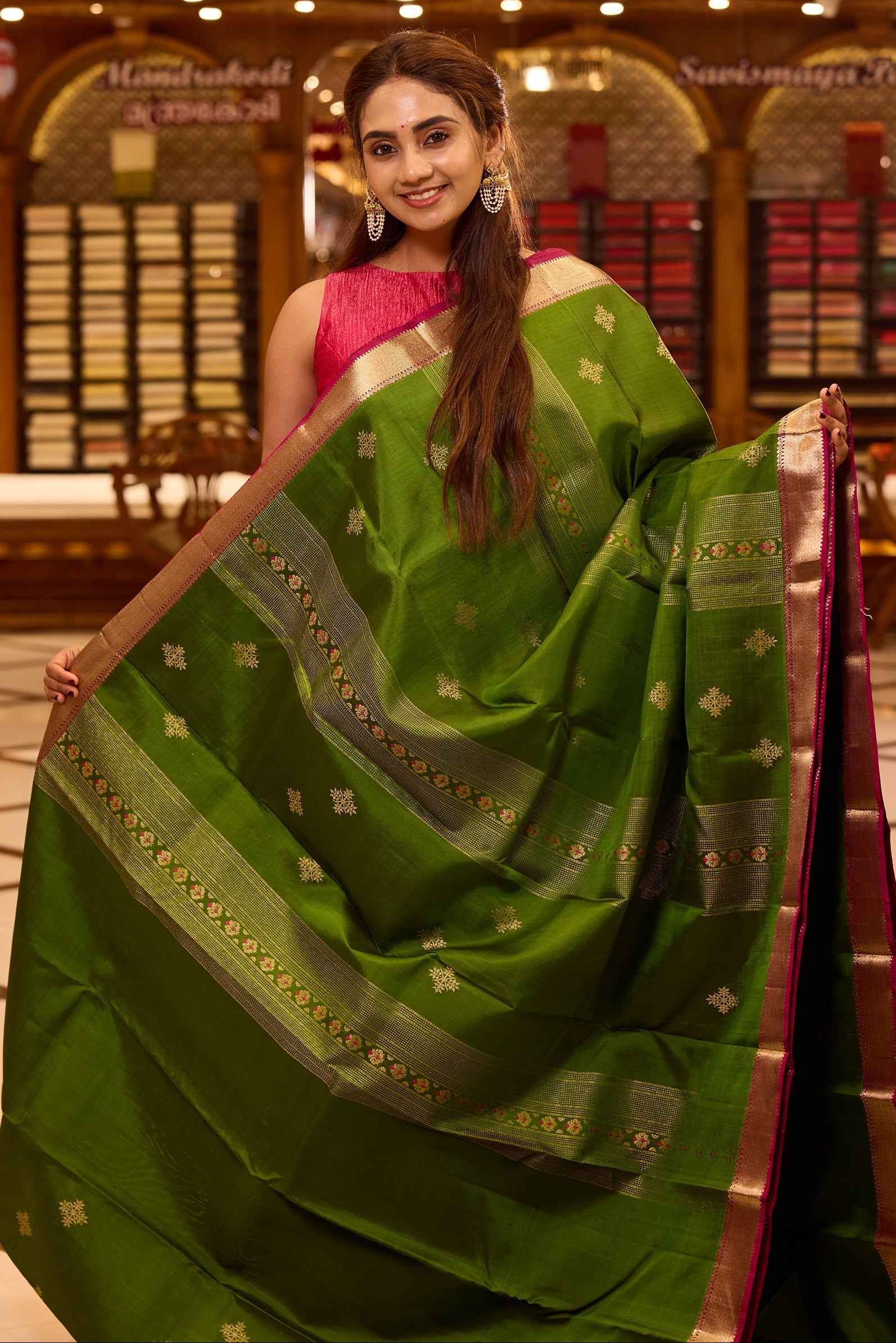 Vibrant parrot green colour Kancheepuram silk saree adorned with delicate gold zari motifs across the body, beautifully complemented by a classic zari border with hints of contrast, styled with a blouse