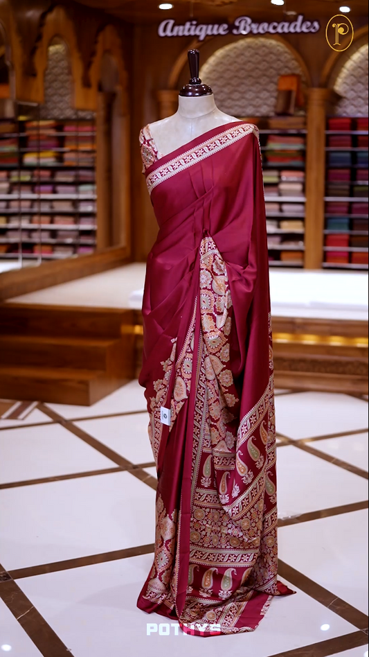 Maroon Semi modal silk saree featuring traditional Ajrakh print with intricate motifs and contrast borders, paired with a perfectly matching blouse & A timeless piece blending heritage with grace.