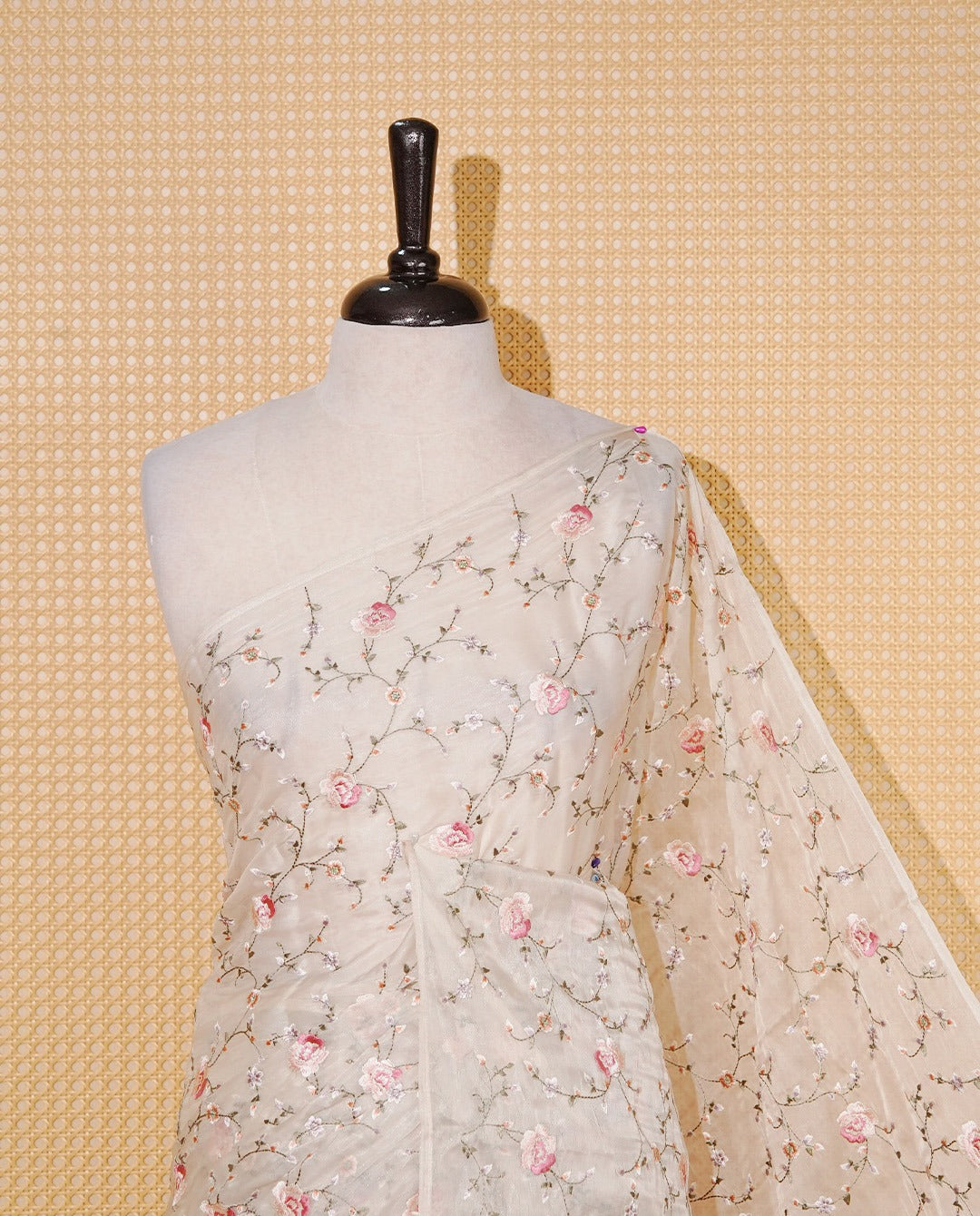 Cream colour Organza saree featuring Floral thread motif on body & floral kodi patterned on one side border and gold kasavu Pallu.
