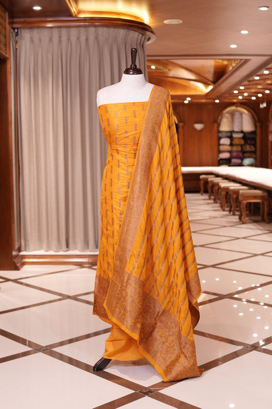 Yellow colour Semi Banarasi Silk top adorned with elegant Copper zari patterns and a rich border, paired with a zari worked dupatta and a plain bottom.