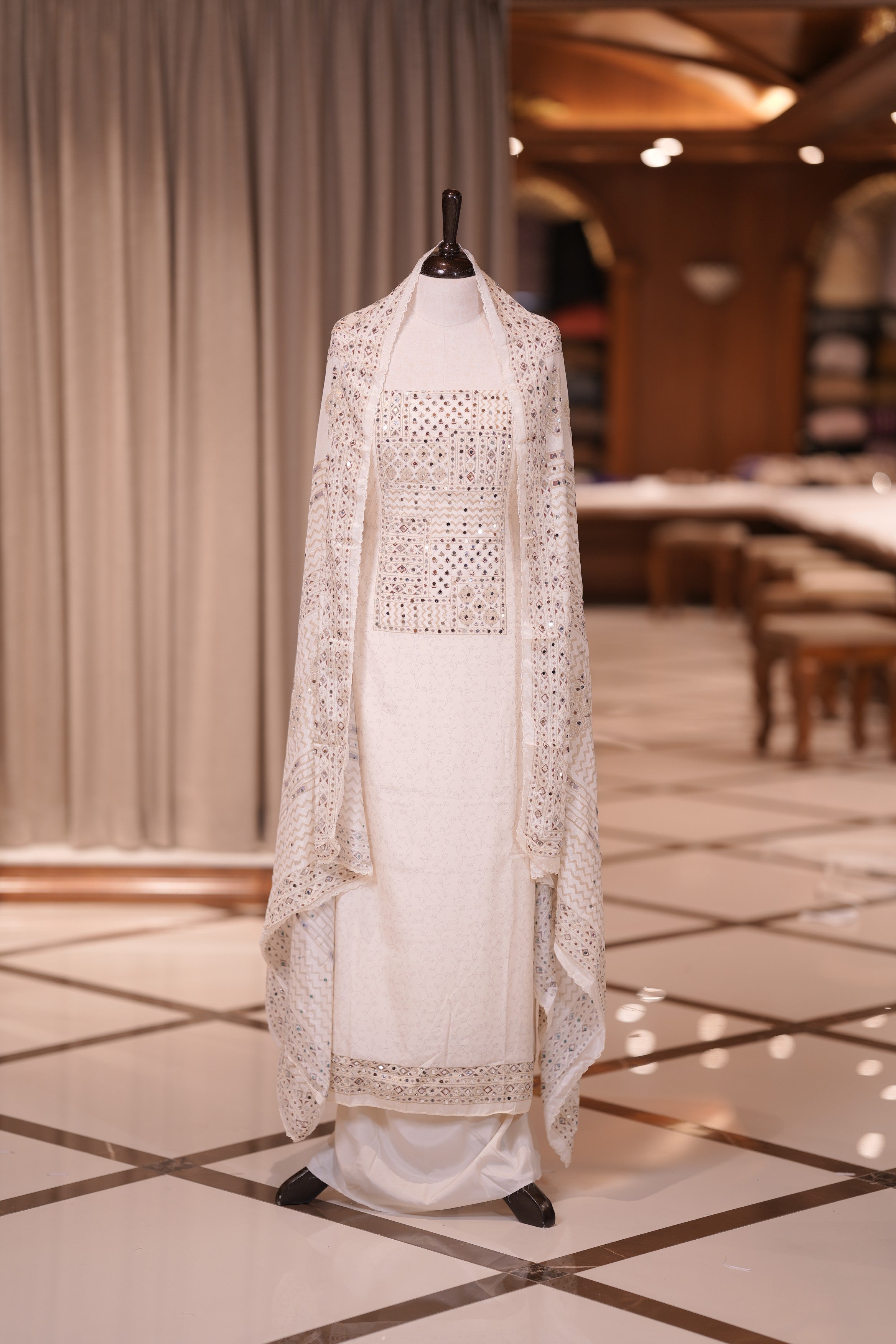 White Colour Crepe Material Top Embellished with Mirror Work, Paired with a Matching Designed Dupatta and Plain Bottom