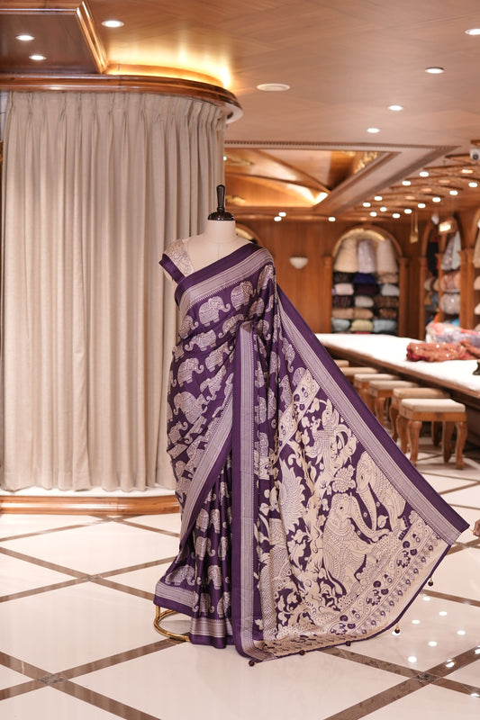 Violet & Cream satin modal saree featuring intricate elephant motifs and an artistic pallu, paired with a matching blouse
