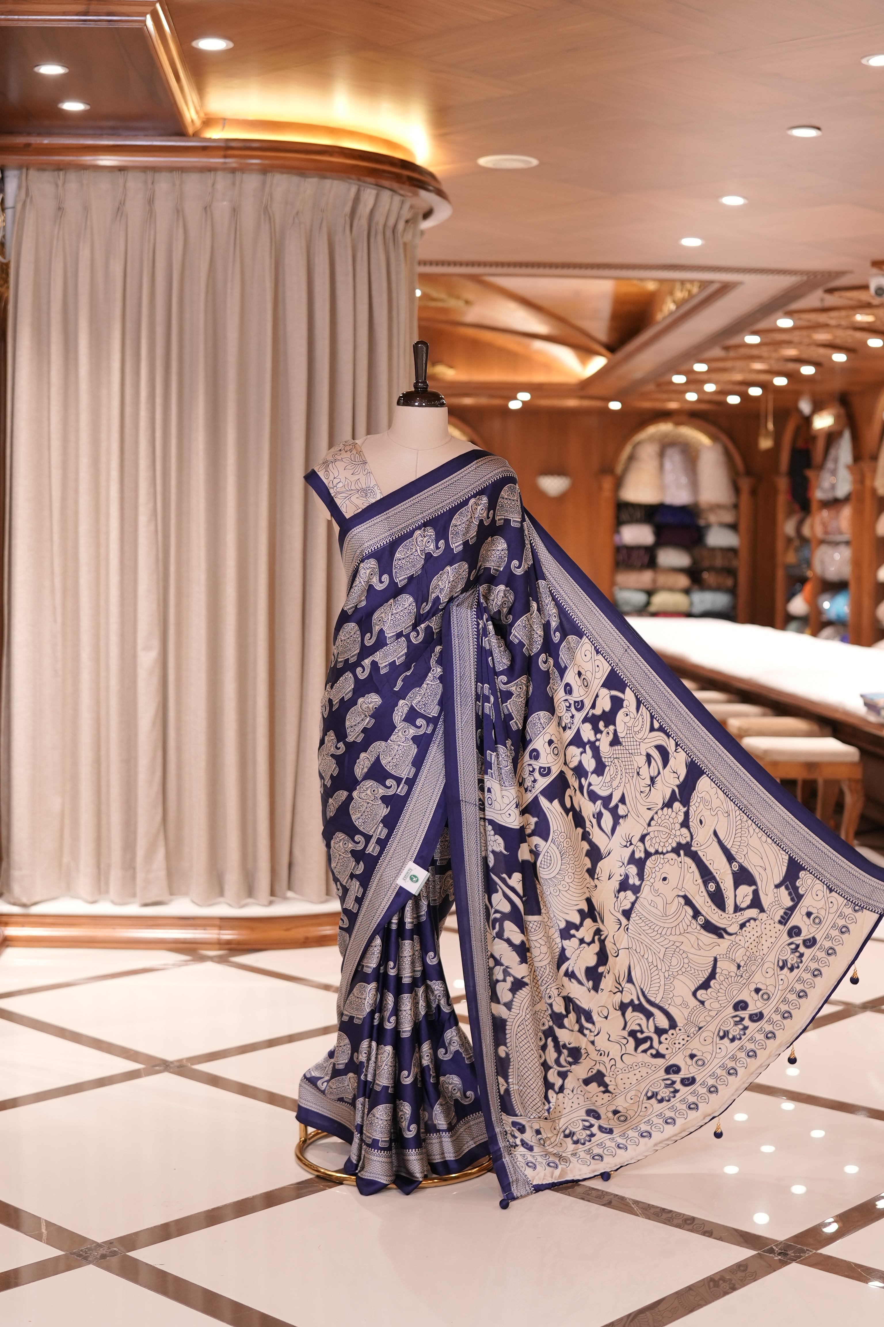 Blue & Cream satin modal saree featuring intricate elephant motifs and an artistic pallu, paired with a matching blouse