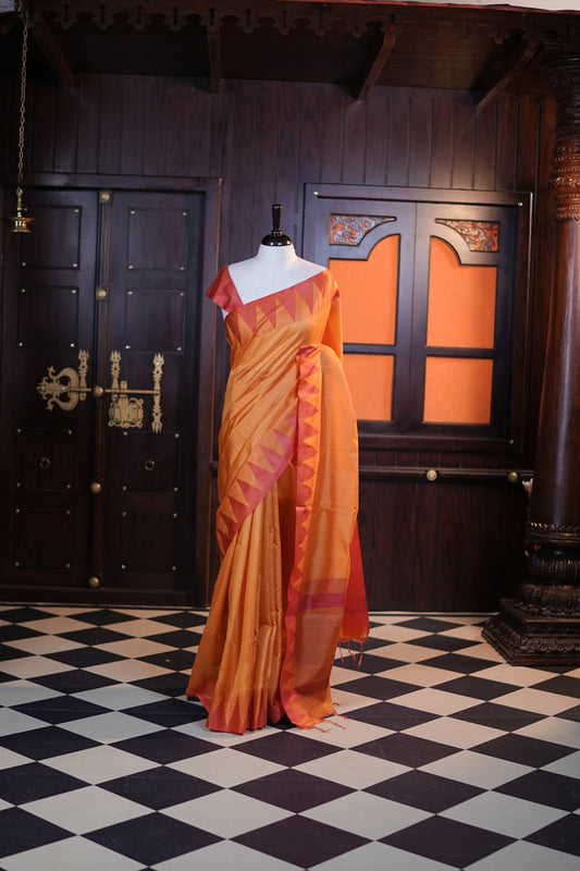 Mustard yellow colour Net cotta saree featuring a striped body with a contrast colored traditional temple-design border, a striped pallu, and paired with a matching blouse.