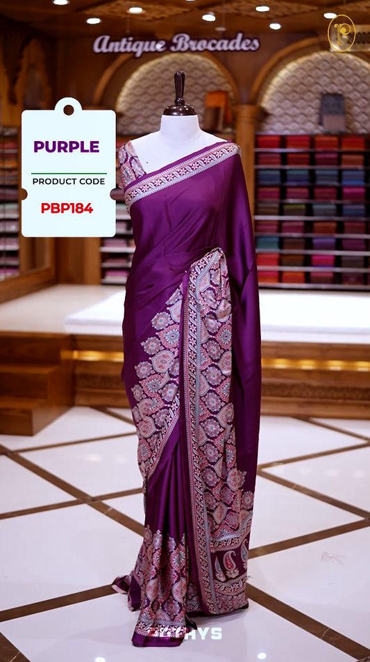 Purple Semi modal silk saree featuring traditional Ajrakh print with intricate motifs and contrast borders, paired with a perfectly matching blouse & A timeless piece blending heritage with grace.