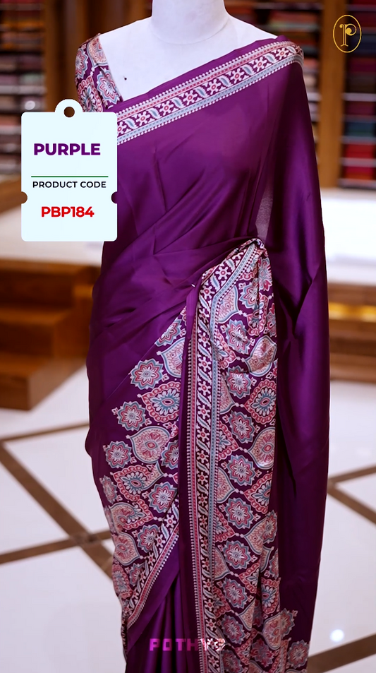 Purple Semi modal silk saree featuring traditional Ajrakh print with intricate motifs and contrast borders, paired with a perfectly matching blouse & A timeless piece blending heritage with grace.