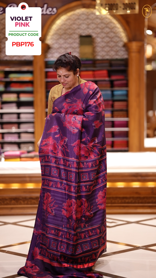 Violet & Pink colour semi silk saree enhanced with a vibrant  floral prints on body & pallu, and comes with a self printed blouse.