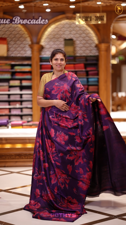 Violet & Pink colour semi silk saree enhanced with a vibrant  floral prints on body & pallu, and comes with a self printed blouse.