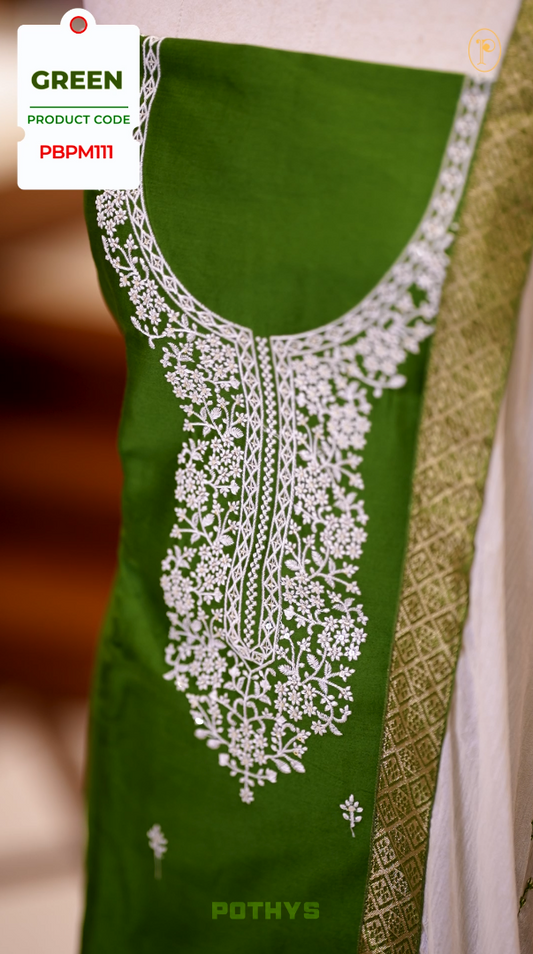 Green colour semi silk salwar set highlighted with intricate white chikankari embroidery on the neckline and body, paired with matching bottom and contrasting ivory dupatta.