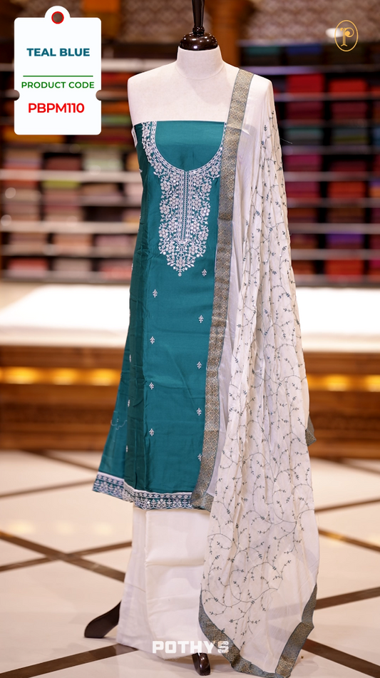 Blue colour semi silk salwar set highlighted with intricate white chikankari embroidery on the neckline and body, paired with matching bottom and contrasting ivory dupatta.
