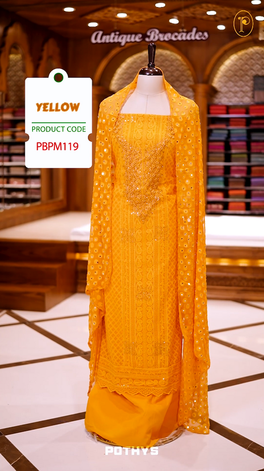 Yellow colour georgette partywear churidhar material featuring intricate stone and beadwork on the top, paired with a plain bottom and a mirror worked dupatta.