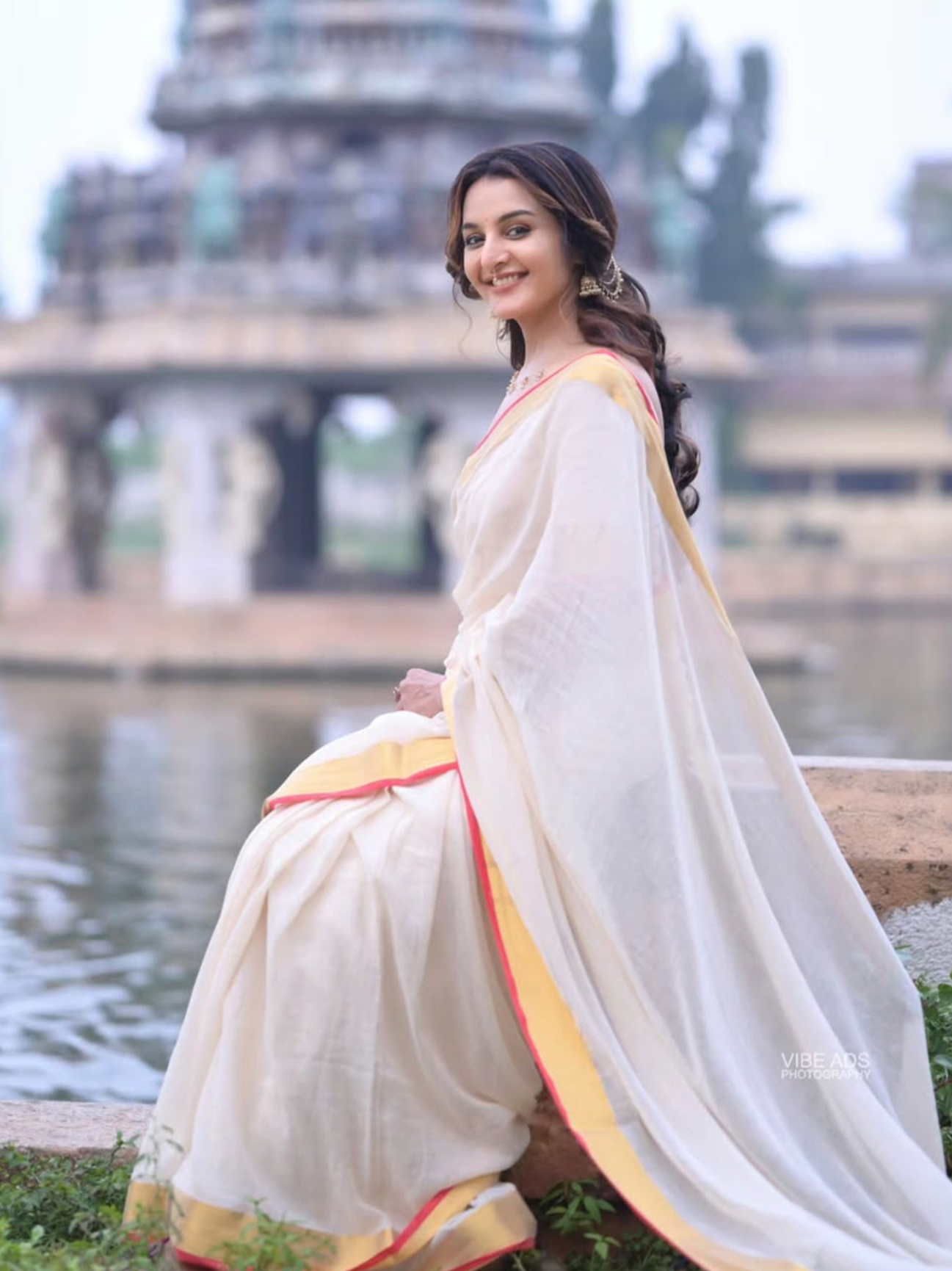 White colour Chanderi cotton saree with a plain body, featuring a Contrast border, paired with a matching blouse piece.