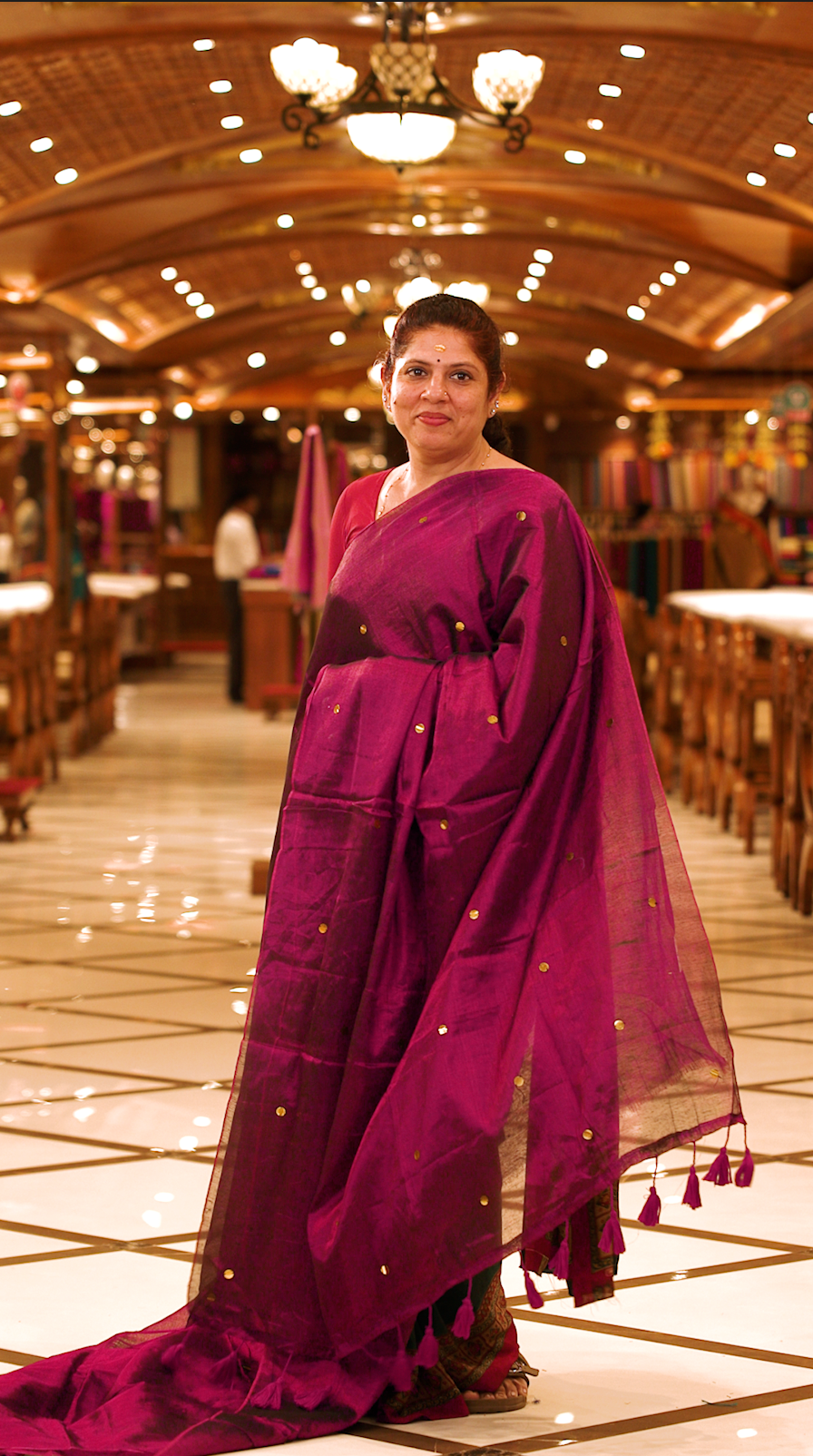 Purple colour Semi Tissue saree featuring a plain body adorned with delicate sequin detailing throughout, crafted in a borderless design. Comes without a blouse piece.
