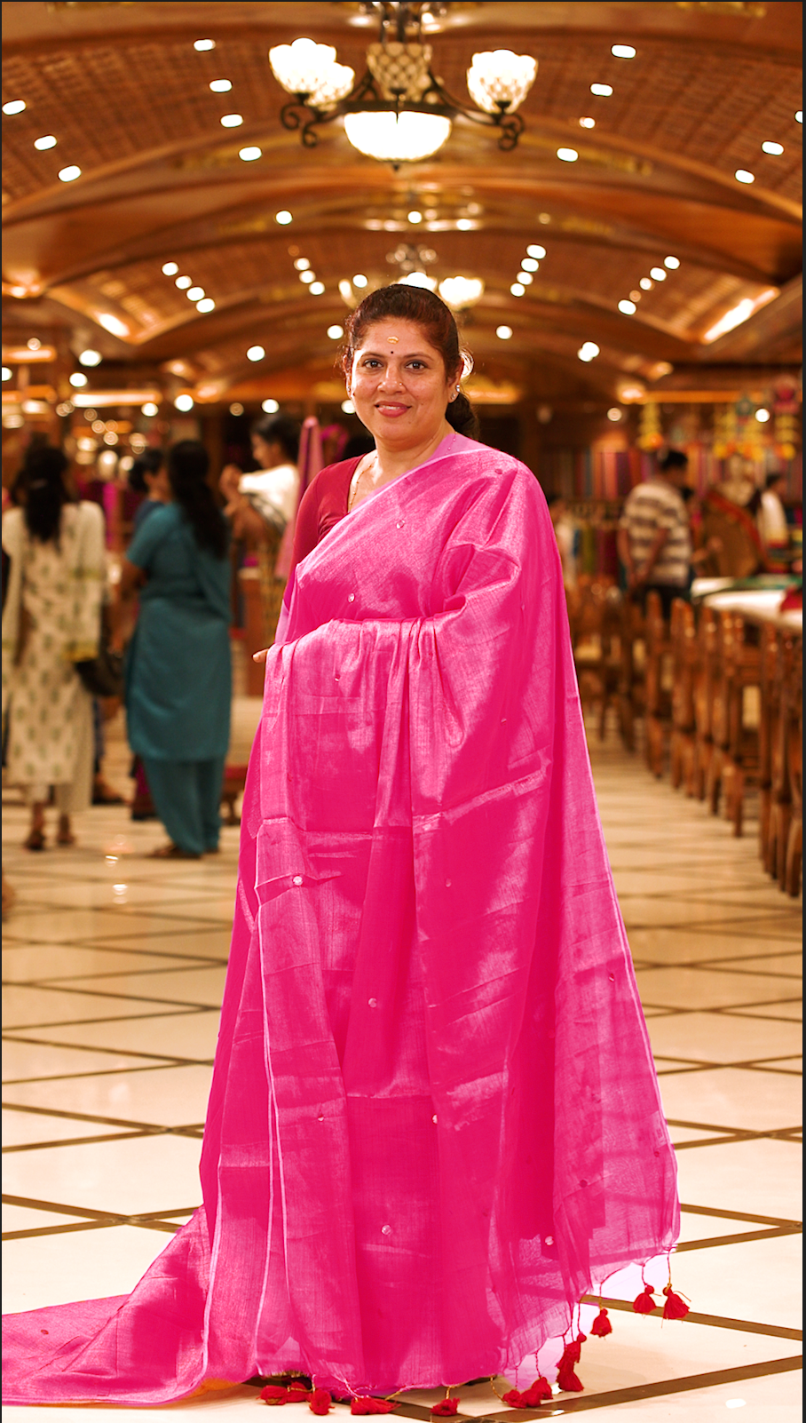 Pink colour Semi Tissue saree featuring a plain body adorned with delicate sequin detailing throughout, crafted in a borderless design. Comes without a blouse piece.