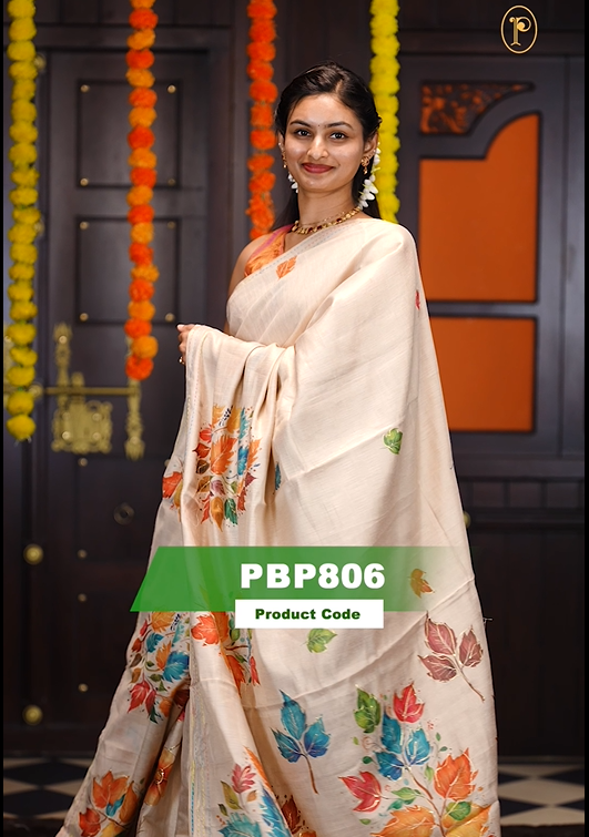 Cream colour soft tissue saree featuring Multicolour Leaf print on body with gold zari outline, kantha stitched detailing border, same print & tassels on pallu, Small floral Print running blouse piece.
