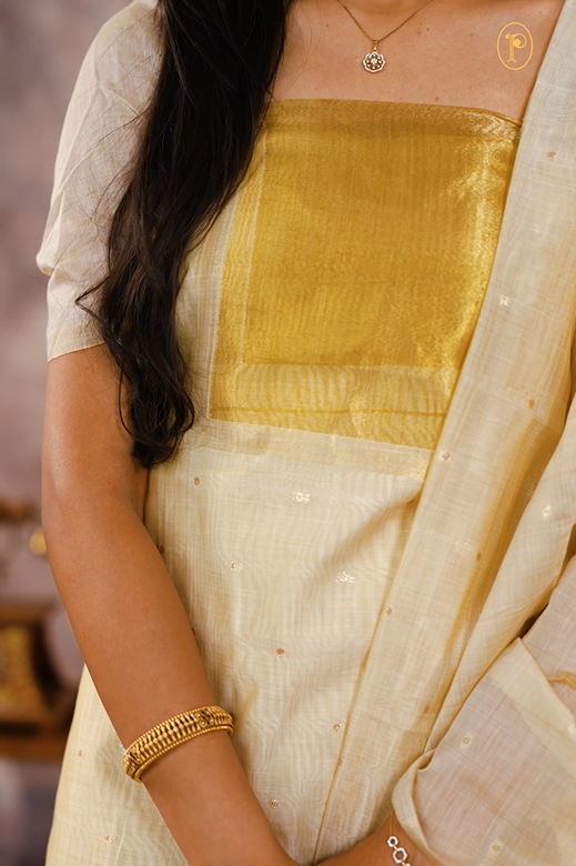 Cream colour Mul chanderi Tissue Salwar material Featuring zari Border detailing, dupatta with small buttas & zari detailing border.