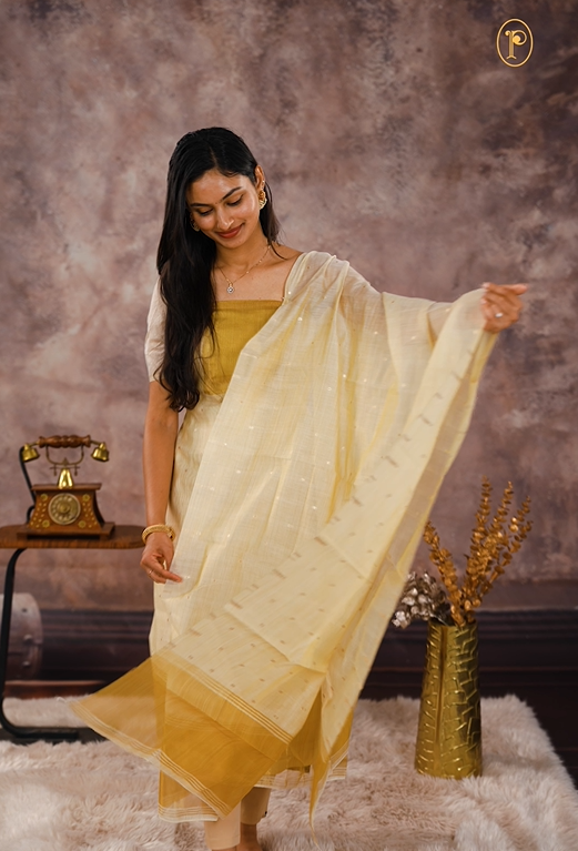 Cream colour Mul chanderi Tissue Salwar material Featuring zari Border detailing, dupatta with small buttas & zari detailing border.