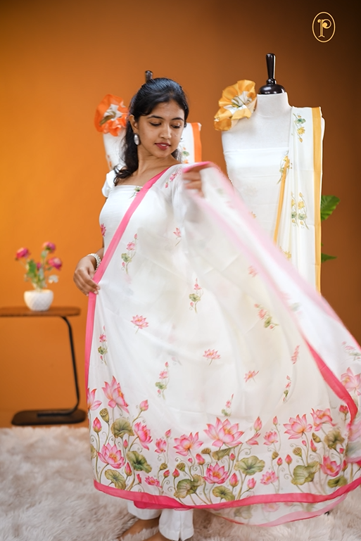 Cream colour Vijithra Silk Material Featuring Pink Lotus Print On body, comes with same colour Dupatta Enhance Beautiful Floral print with small Pink  border.