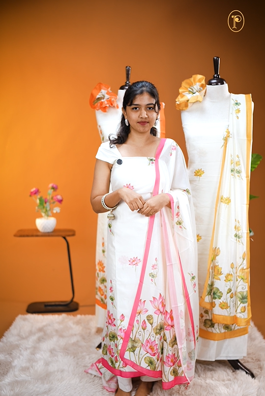 Cream colour Vijithra Silk Material Featuring Pink Lotus Print On body, comes with same colour Dupatta Enhance Beautiful Floral print with small Pink  border.
