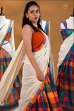 Orange, Purple, Red & Olive colour Dhavani set featuring Check pattern skirt, comes with Matching blouse piece, Paired with white Dupatta With gold zari strip & Madras check border.