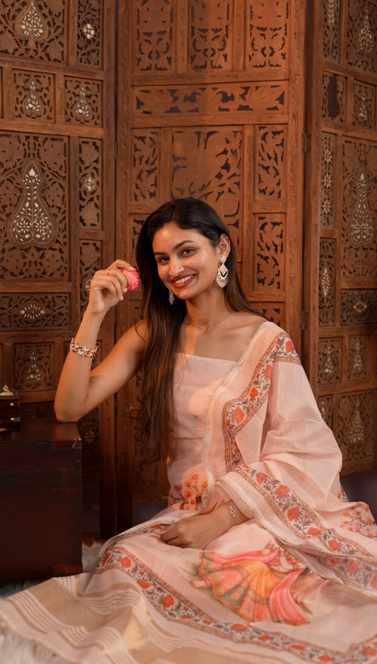 Peach colour Net Cotton Salwar material with Small buttas & zari line Border top, zari kasavu detailed with floral print border & RadhaKrishna Digital print dupatta, santoon material bottom.