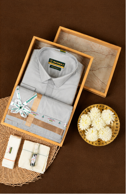 RAMRAJ  Silver Grey Colour shirt paired with a matching dhoti , all elegantly finished with a gold border.