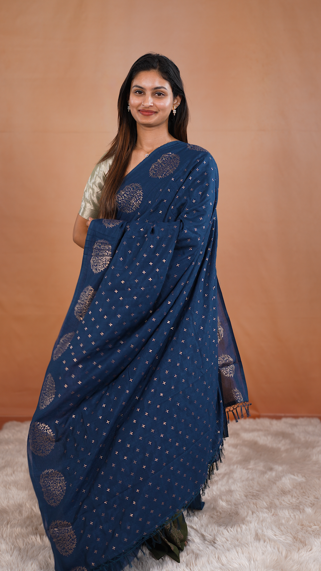 Navy Blue colour vijithra silk saree featuring small zari details on body, Tree design border.
