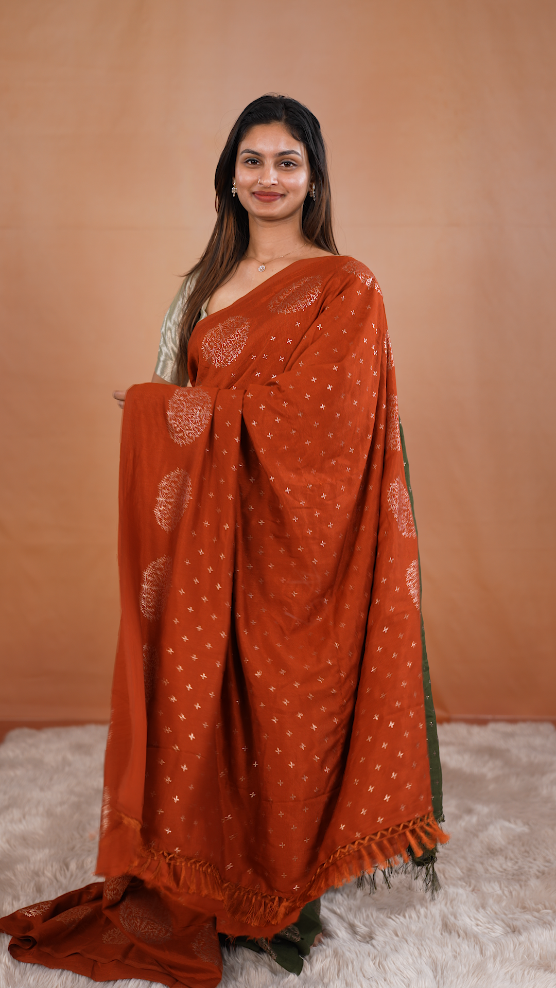 Rust orange colour vijithra silk saree featuring small zari details on body, Tree design border.