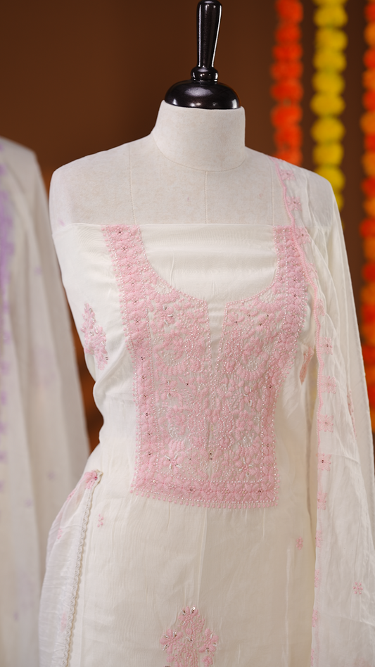 Ivory Colour Mul Chanderi Salwar material featuring Baby Pink Embroidery & Delicate Bead Work on body, paired with Santon bottom & Embroidery Worked Dupatta With Scallop border.