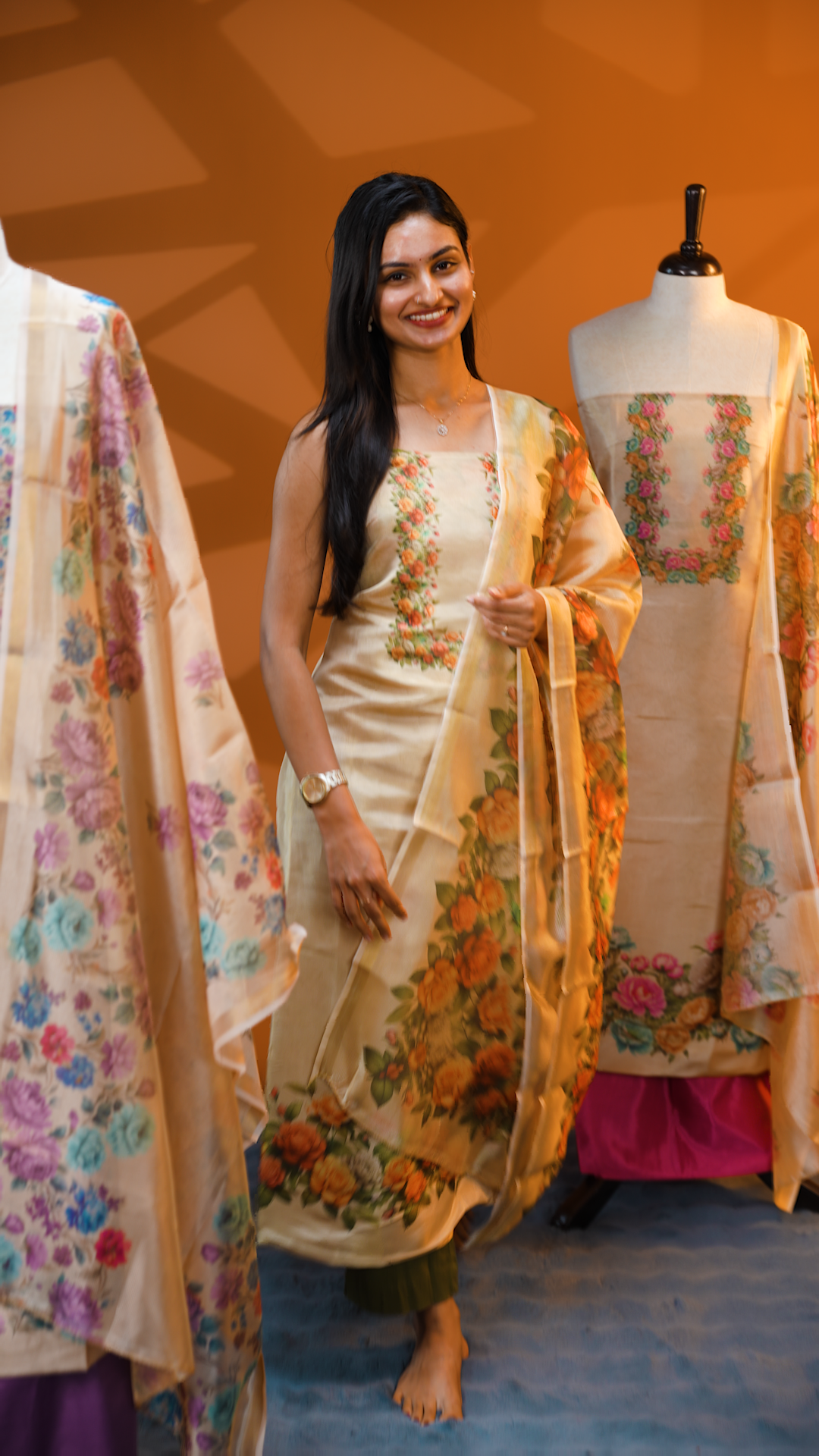 Light gold colour Tissue Salwar material featuring Sandal colour floral print, paired with Dupatta with same print & Golden line detailed border and santoon bottom material.