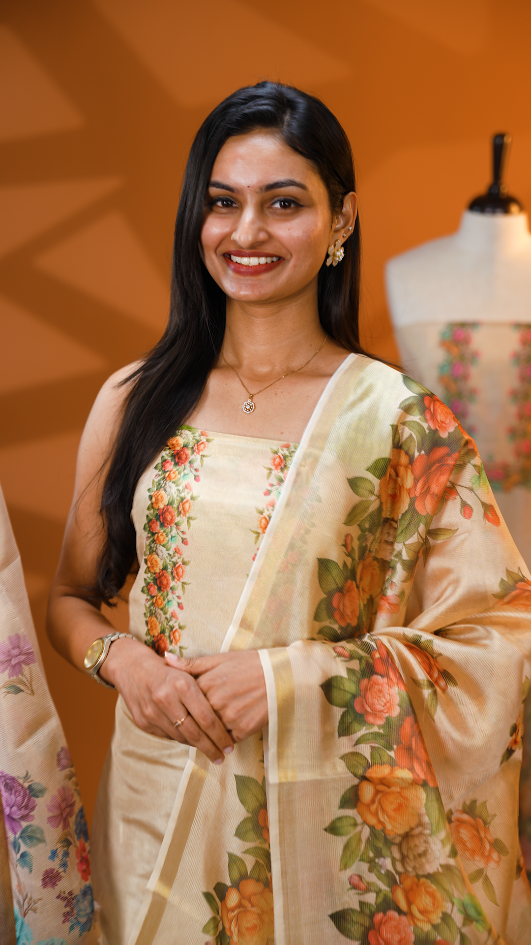 Light gold colour Tissue Salwar material featuring Sandal colour floral print, paired with Dupatta with same print & Golden line detailed border and santoon bottom material.