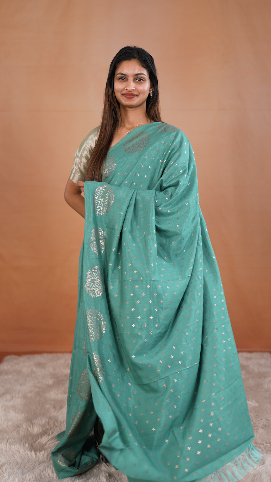 Sea Green colour vijithra silk saree featuring small zari details on body, Tree design border.
