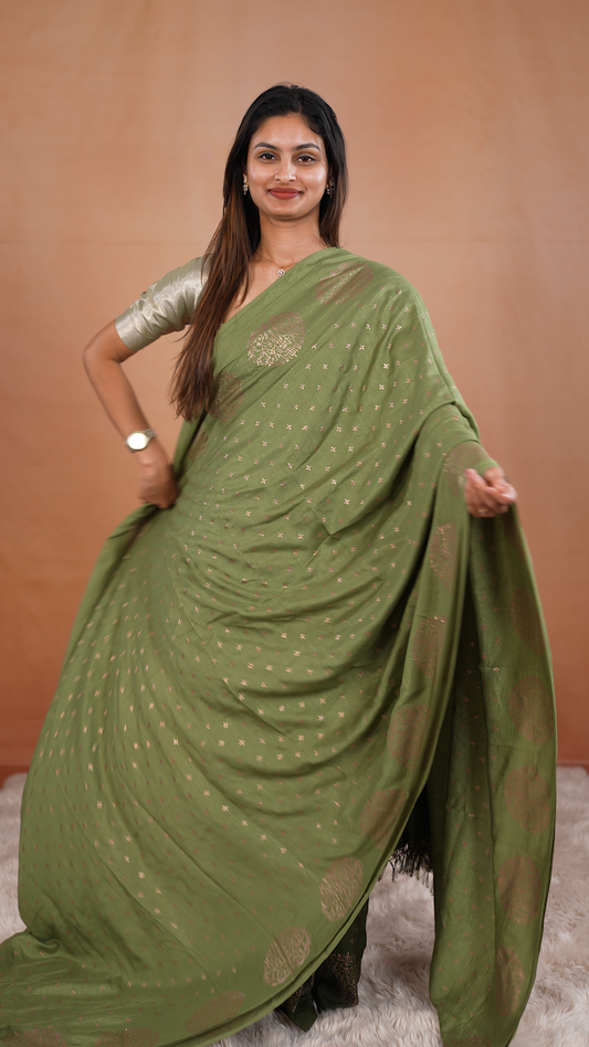 Light Green colour vijithra silk saree featuring small zari details on body, Tree design border.