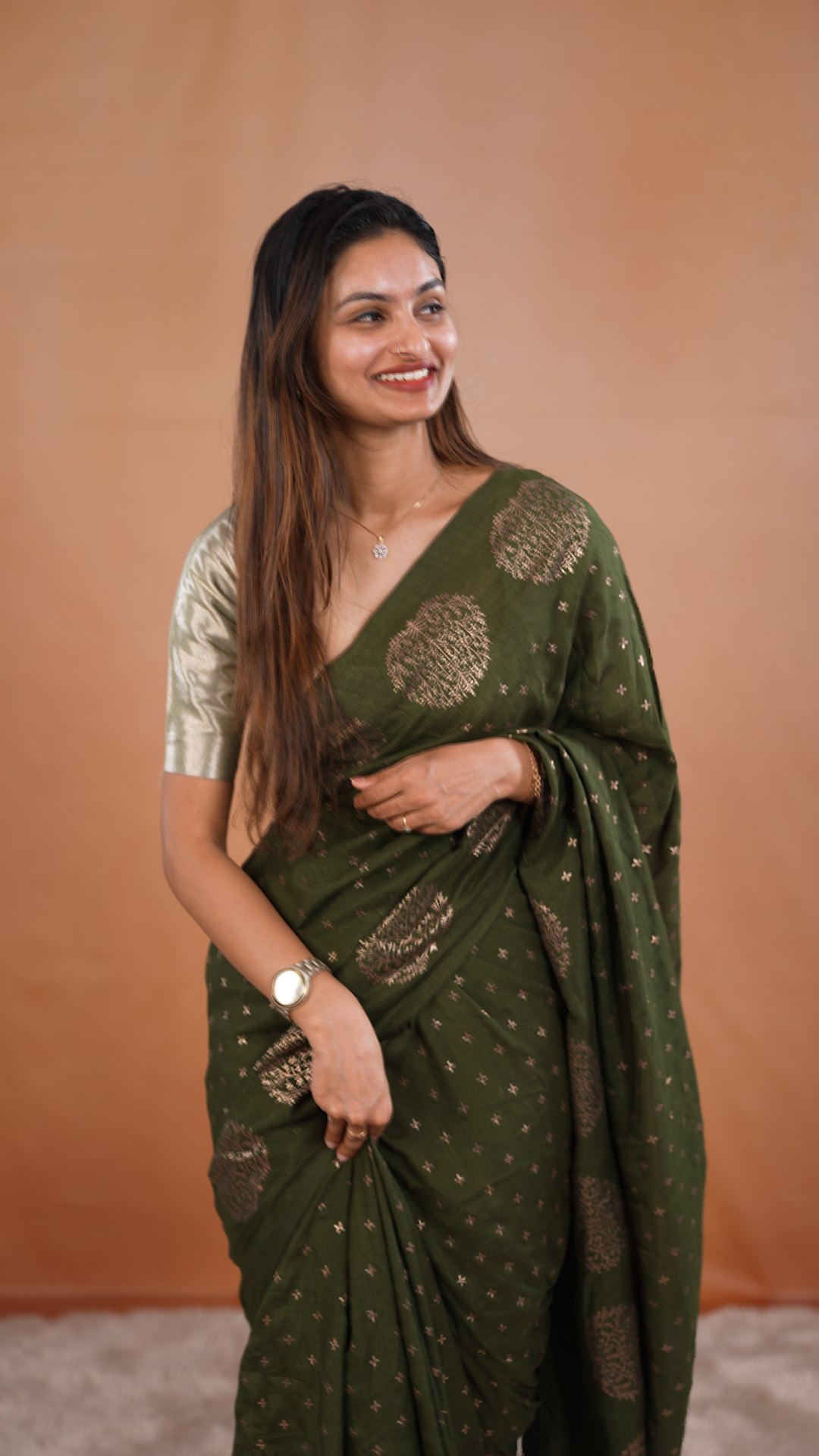 Olive colour vijithra silk saree featuring small zari details on body, Tree design border.