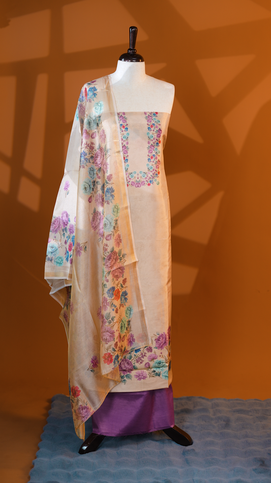 Light gold colour Tissue Salwar material featuring Pink & Blue colour floral print, paired with Dupatta with same print & Golden line detailed border and santoon bottom material.