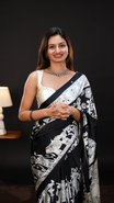 Black Colour Semi Modal silk saree featuring Kalamkari print associate with mirror details on body, matching kalamkari print border.