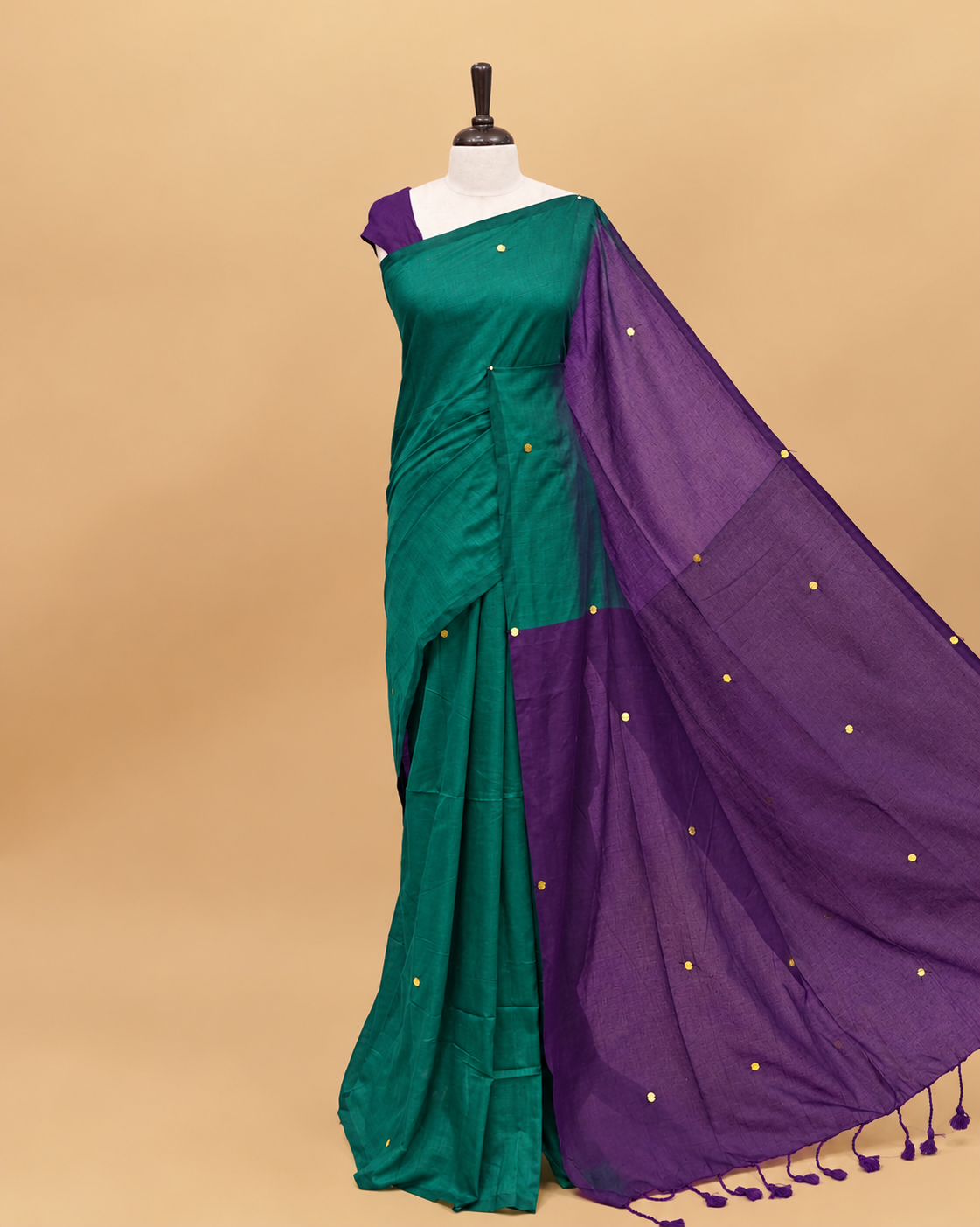 Teal and Violet coloured half and half mul cotton saree featuring elegant sequin detailing on the body, finished with a beautiful pallu adorned with tassels.